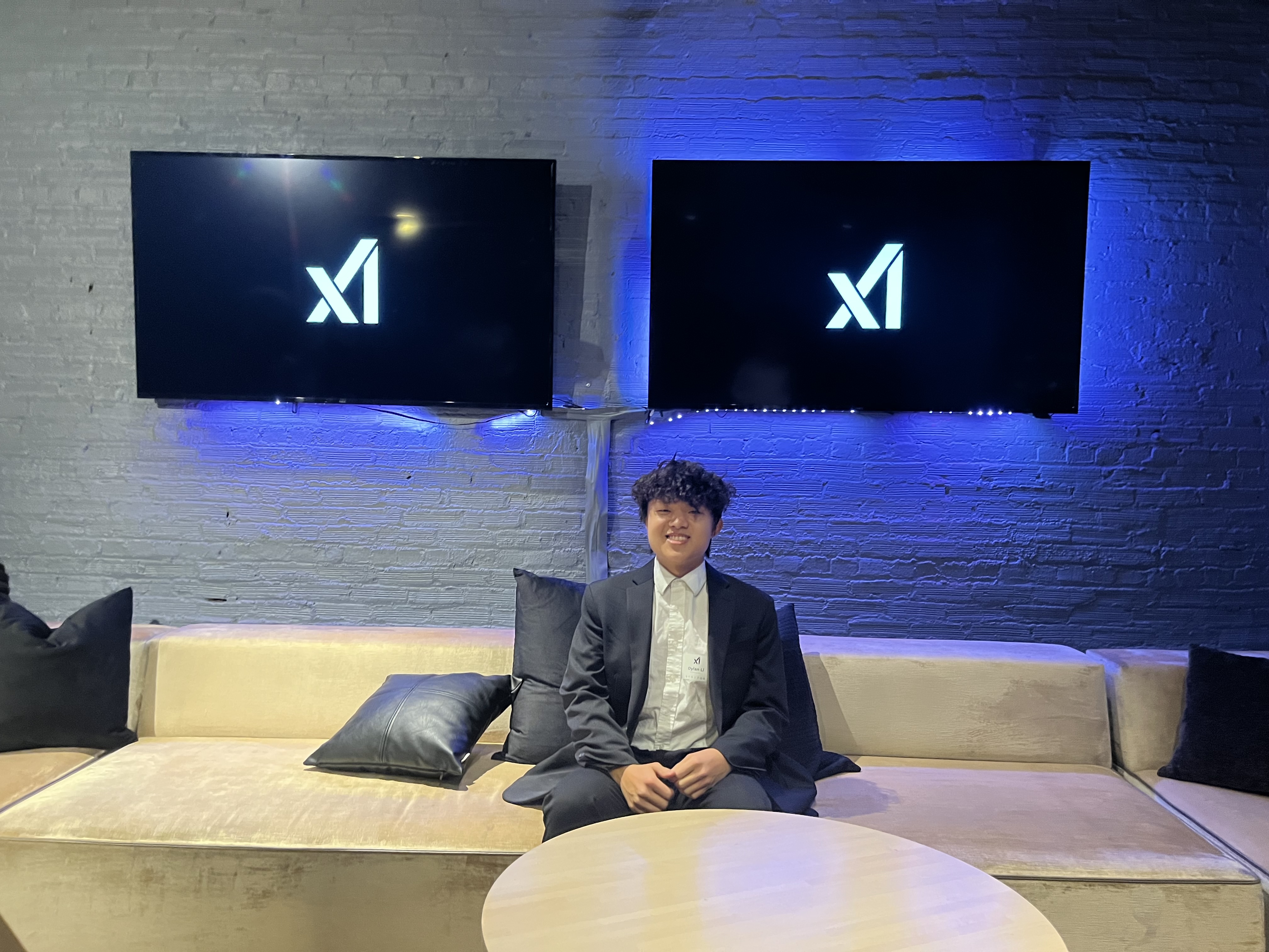 Image of me in front of the xAI logo